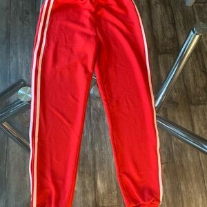 Red Track Pants with White Stripes